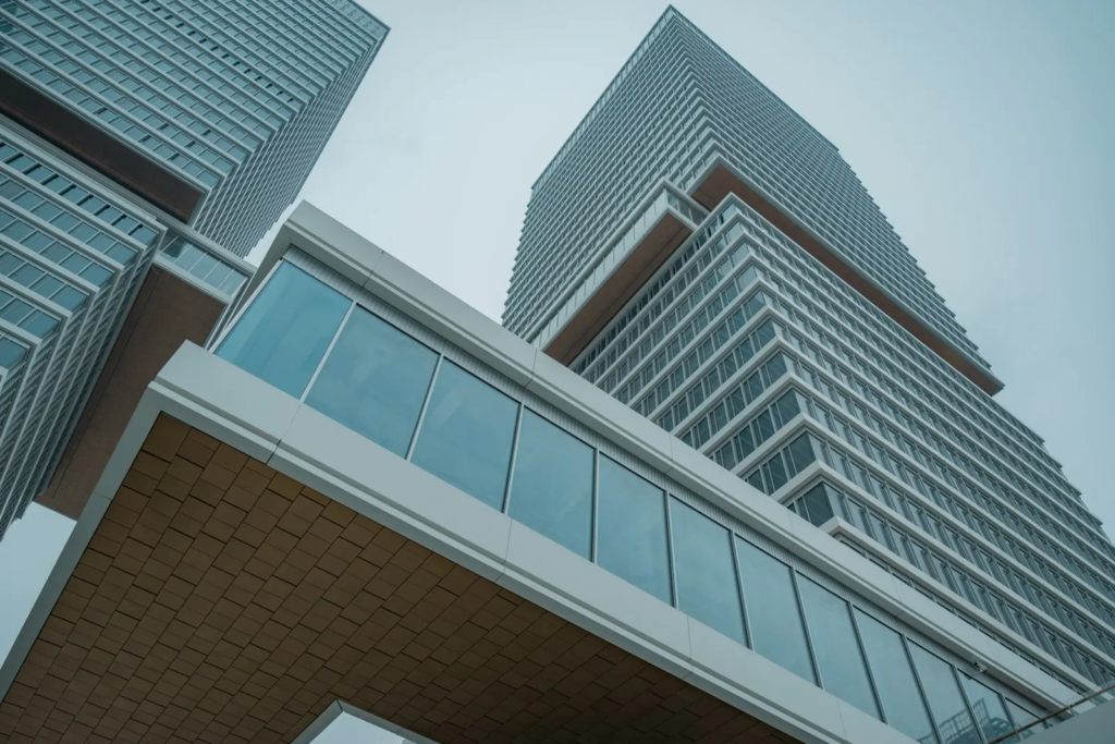 a very tall building sitting next to a very tall building