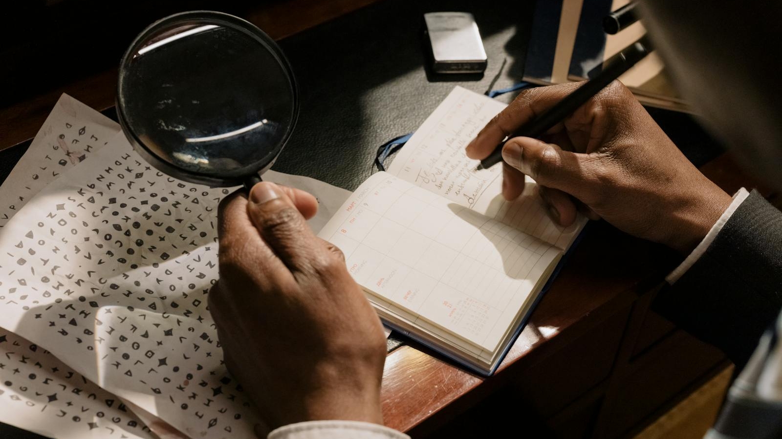 A detective decoding cipher documents with a magnifying glass, notebook in hand.