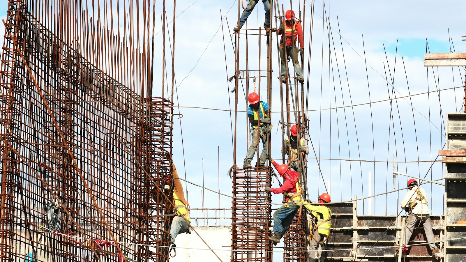 people working on building during daytime
