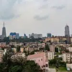 Cityscape with modern skyscrapers and dense residential buildings